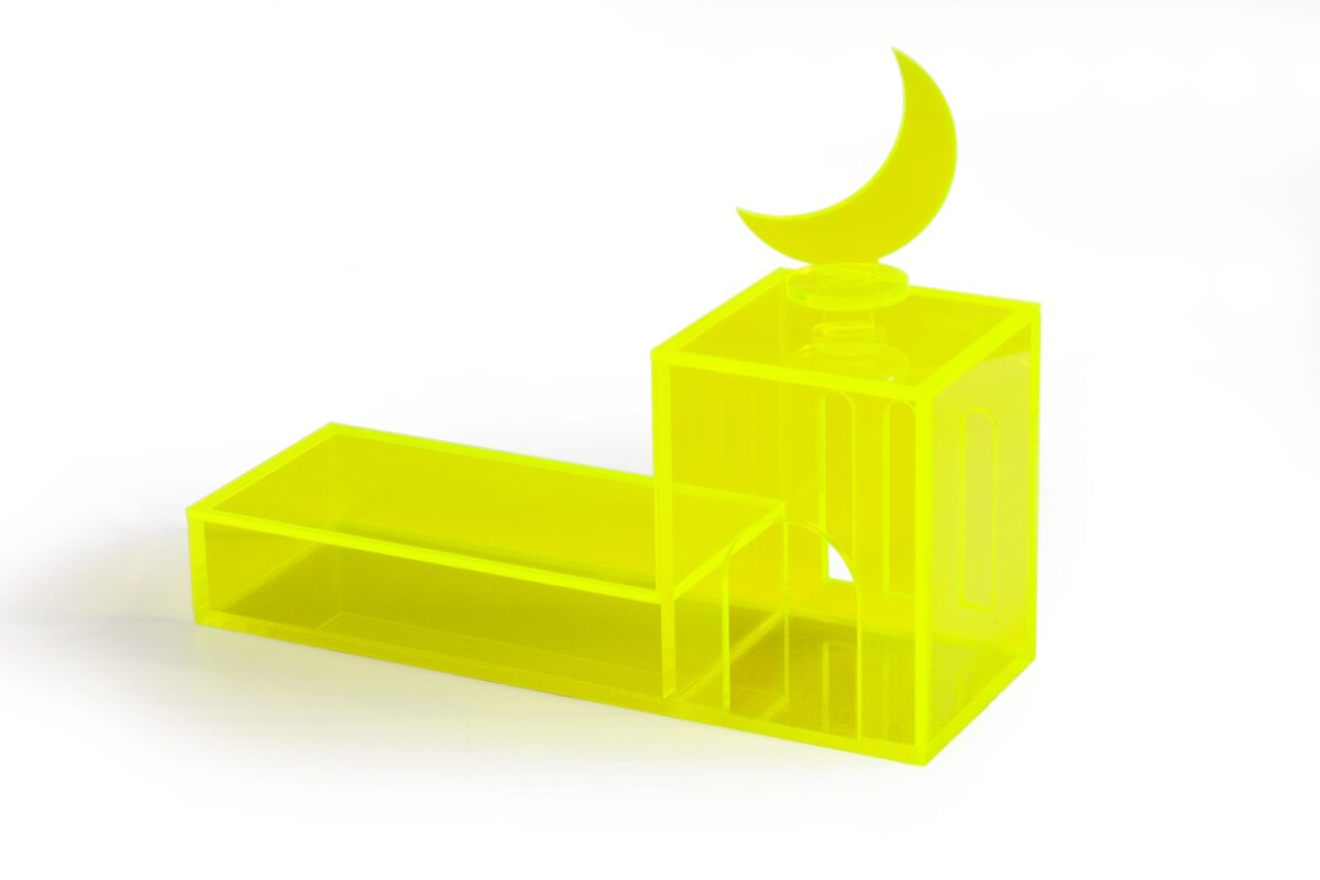 An acrylic mosque, from the collection "Tareef", in bright neon color, with a cover on the dome part, and a cover on the long rectangular plate.
