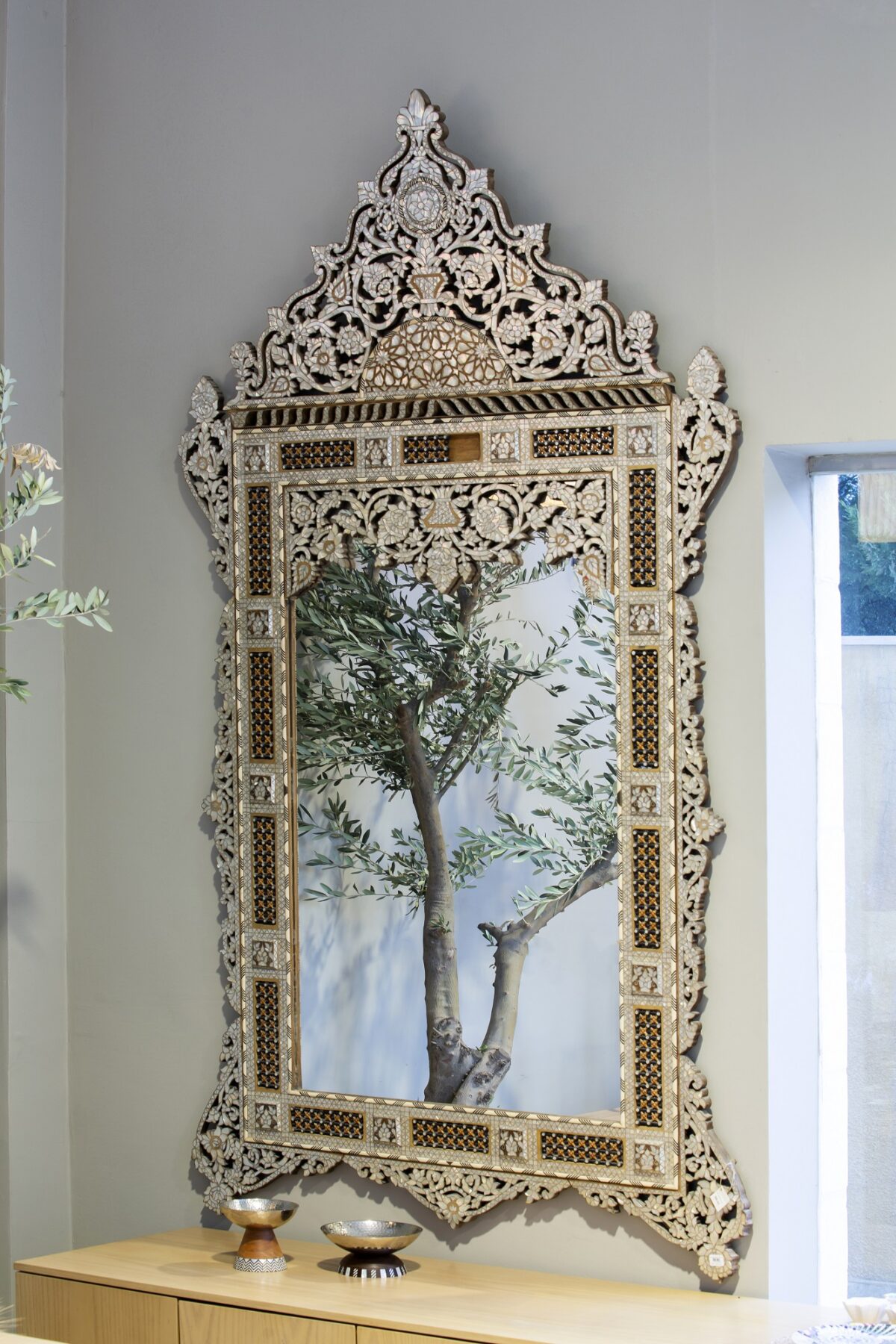 alt="Wood and mother of pearl mirror"