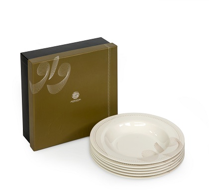 alt="dotted soup plates with golden writing calligraphy"