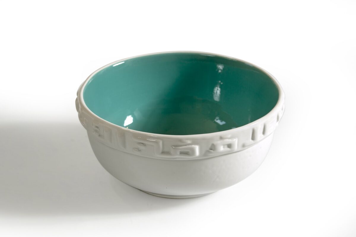 alt="Ceramic bowl with terquise