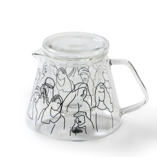 alt="tea pot grey with faces and figures"
