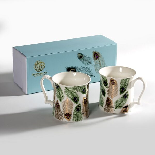 alt="Peacock Coffee mugs with colorful painted feathers"