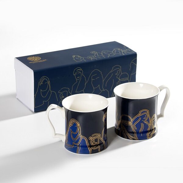 alt="Faces and figures mug with gold writing and navy blue background calligraphy"