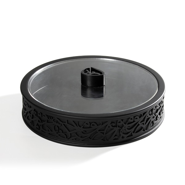 alt="round black box with arabic letters and clear plexi lid"
