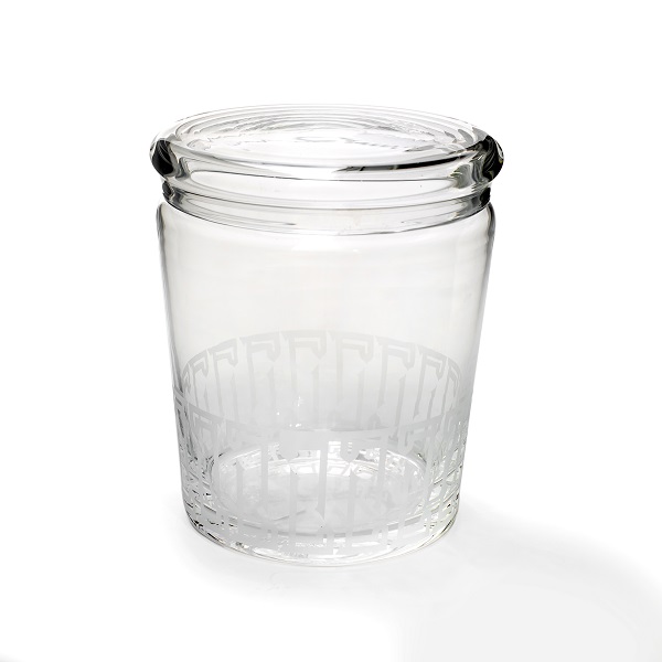 alt="clear glass cannister with white arabic letters"