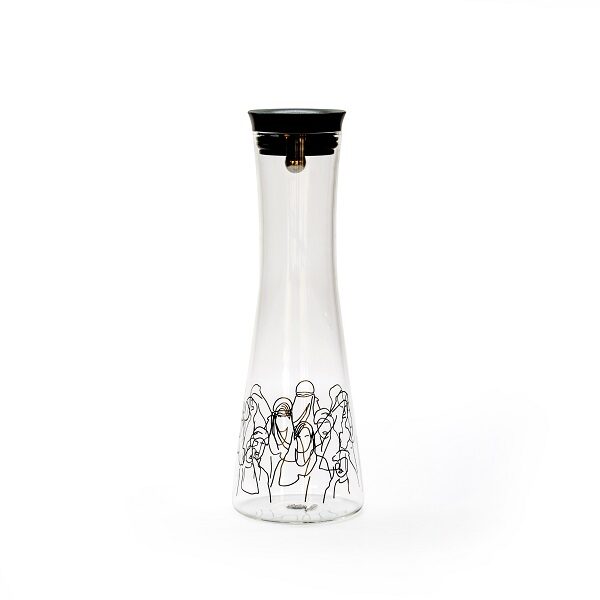 alt="clear jug with black drawings of people"