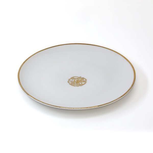 alt="porcelain dessert plate with calligraphy and sand dunes"