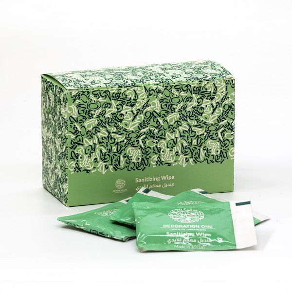 alt="green packet sanitising wipes with arabic letters"