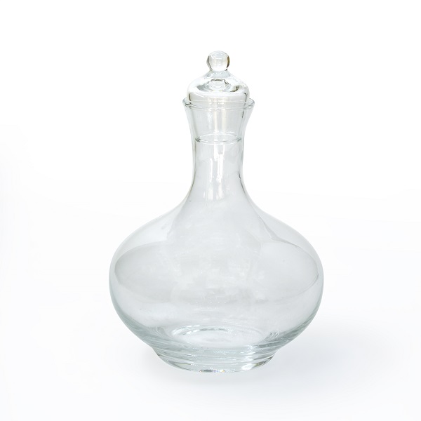alt="clear glass decanter with lid"