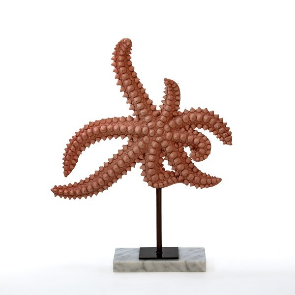 alt="orange polyresin starfish on stand"