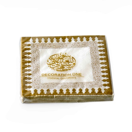 "Printed napkins, with gold design and Arabic calligraphy on its border. The verse is written by the poet Al Mutanabi describing how people's true selves is shown in how generous they are. عَلى قَدرِ أَهلِ العَزمِ تَأتي العَزائِمُ وَتَأتي عَلى قَدرِ الكِرامِ المَكارِم. Napkin size 21x21cm when open, 2ply tissue, 20 napkins per pack."