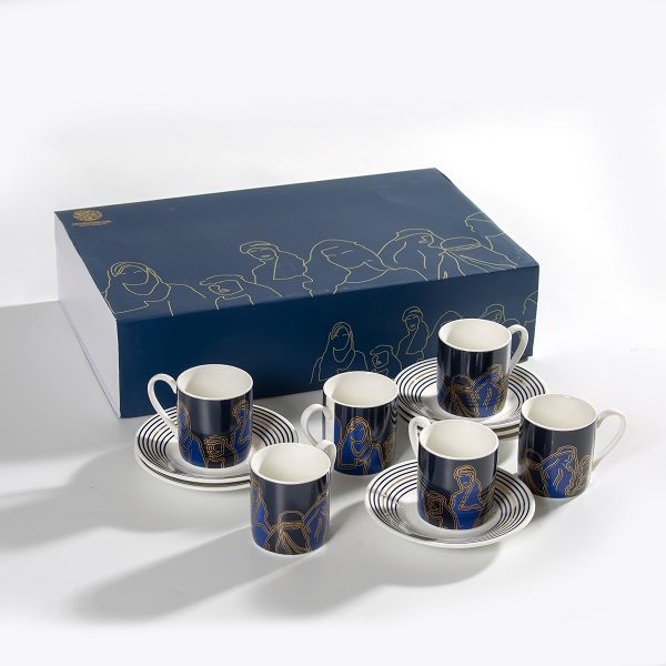 alt="Faces and figure shapes Turkish coffee cups with navy blue background and gold writing"