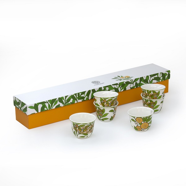 alt="white porcelain arabic coffee cups with flower design"
