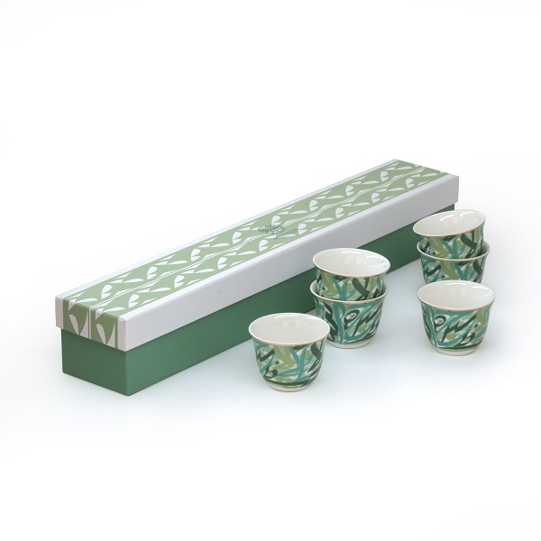 alt="porcelain arabic coffee cups with arabic calligraphy in green"