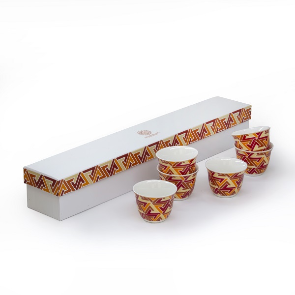 alt="white porcelain arabic coffee cups with colourful design"